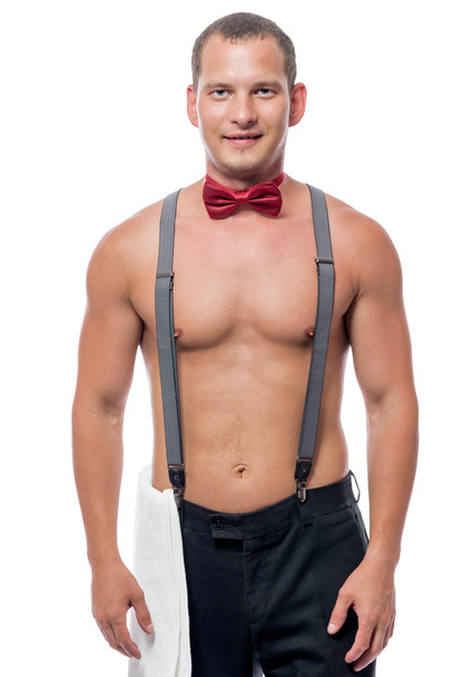portrait of a waiter in a bow tie and suspenders on a white back - 写真・画像