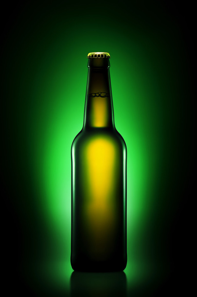 Bottle of beer in brown bottle with clipping path on green gradient background - Photo, Image