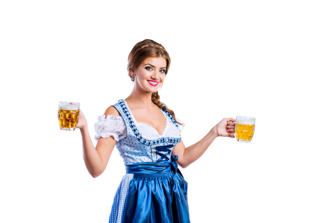 Woman in bavarian dress with beer - Fotó, kép
