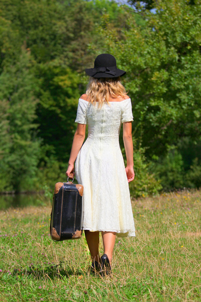 Young woman with a suitcase - Fotografie, Obrázek