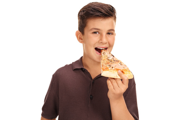 Kid eating a slice of pizza  - Fotó, kép