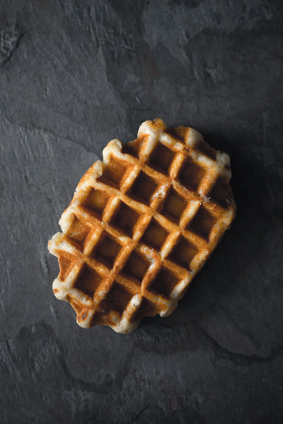 Belgian waffle on the dark stone background vertical - Fotoğraf, Görsel