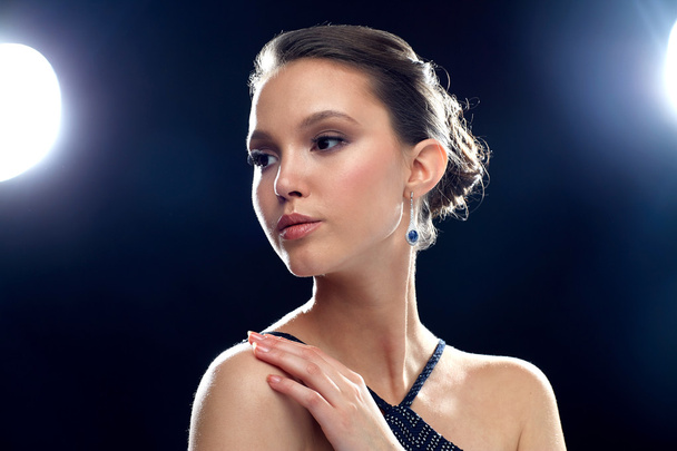 beautiful young asian woman with earring - Foto, imagen
