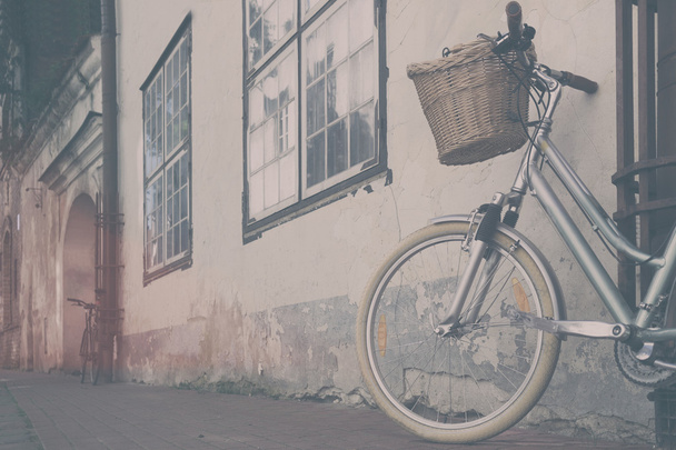 Bicycle with a basket in the old town - Photo, Image