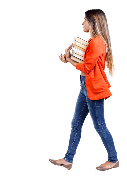 Girl comes with  stack of books. - Φωτογραφία, εικόνα