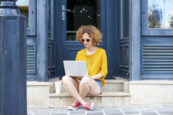 Woman with laptop working online - Fotó, kép