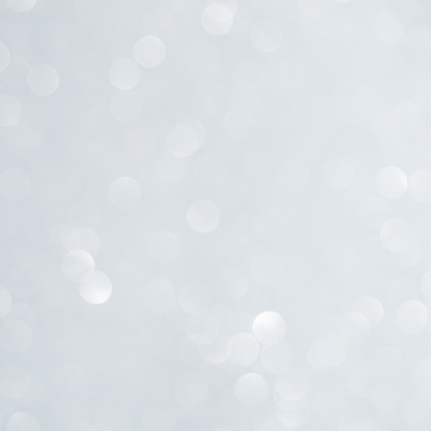 Unfocused abstract white glitter bokeh holiday background. Winter xmas holidays. Christmas. - Photo, Image