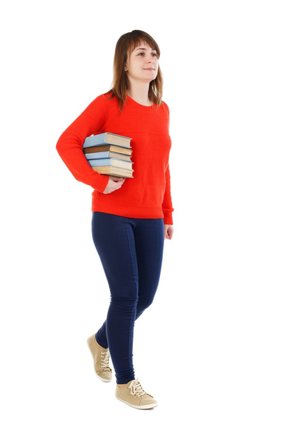 Girl comes with  stack of books. - Photo, image
