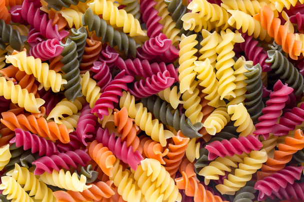 Closeup of raw eco macaroni pasta background.  - Fotografie, Obrázek