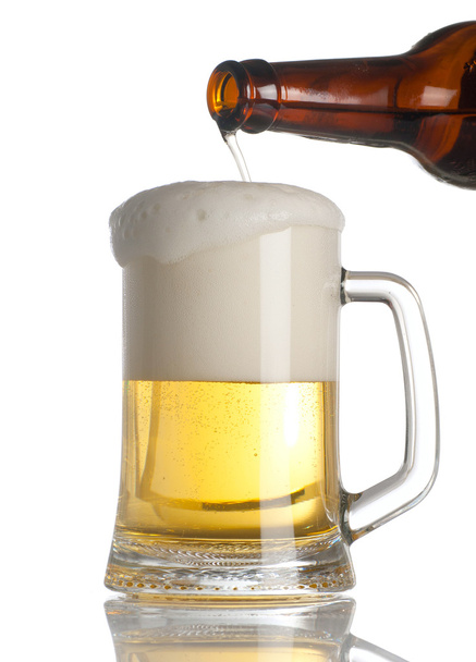 Beer pouring into glass on white - Zdjęcie, obraz