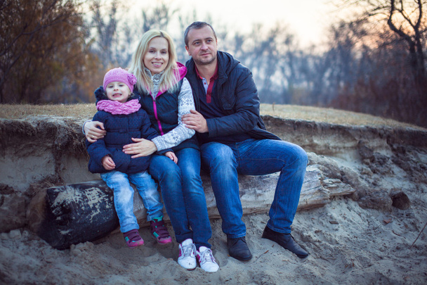 Happy family walking at the autumn park. - Valokuva, kuva