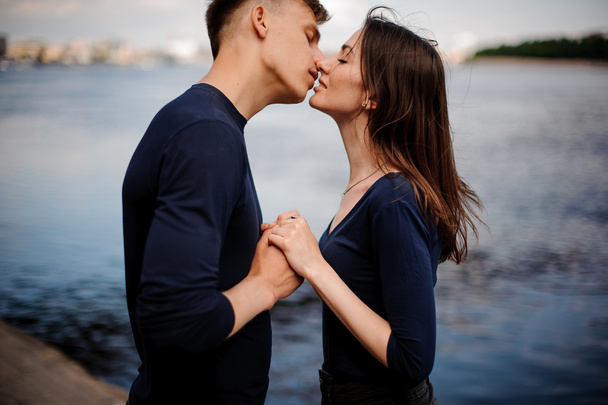 Side view of romantic young couple kissing - Fotografie, Obrázek