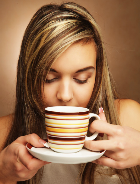 young pretty woman drinking coffee - 写真・画像