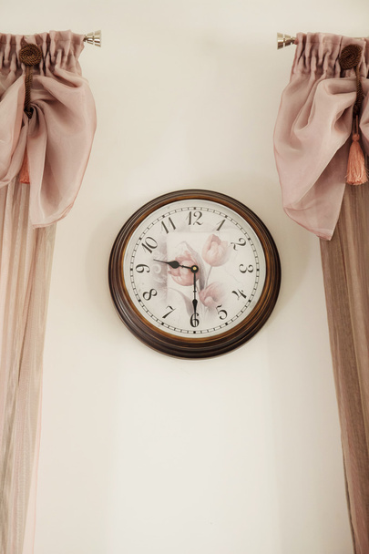 Round, beautiful wall clock, with rose pattern - Photo, image