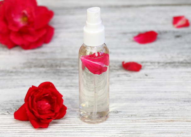 Rose water with a rose petal inside  - Photo, Image