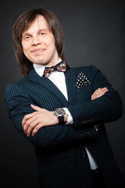 smiling handsome man with long hair brunette and brown eyes in d - Фото, зображення