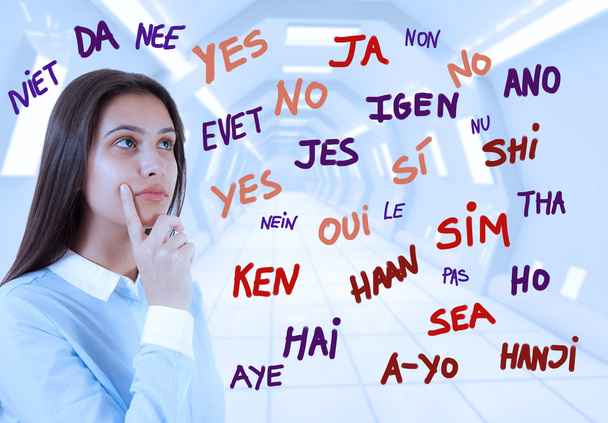 Young brunette girl and word yes in many languages - Photo, image