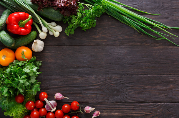 Border of fresh vegetables on wooden background with copy space - Photo, Image