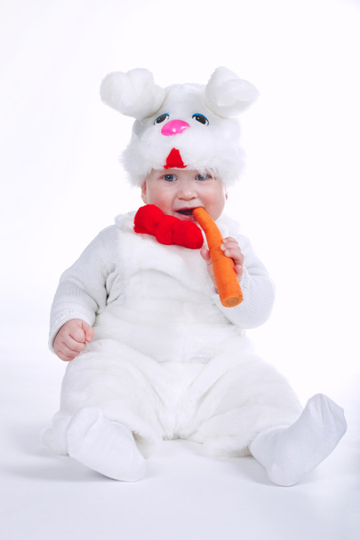 little boy in rabbit costume with carrot isolated - Foto, Bild