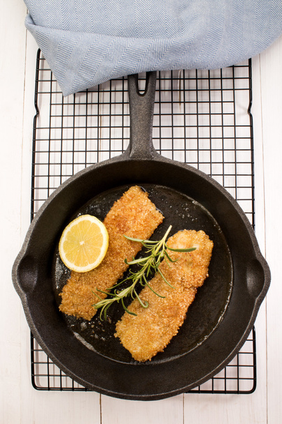 grilled kipper with oat bran in a cast iron pan - Photo, Image