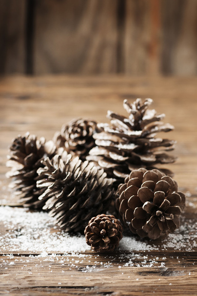 Christmas cones on table - Fotoğraf, Görsel