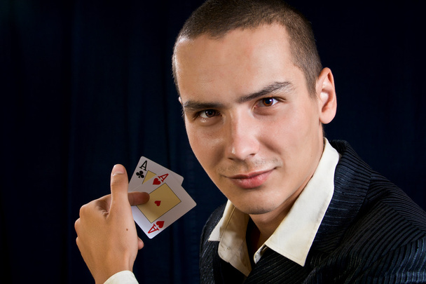 Young lucky gambler with cards - Foto, imagen
