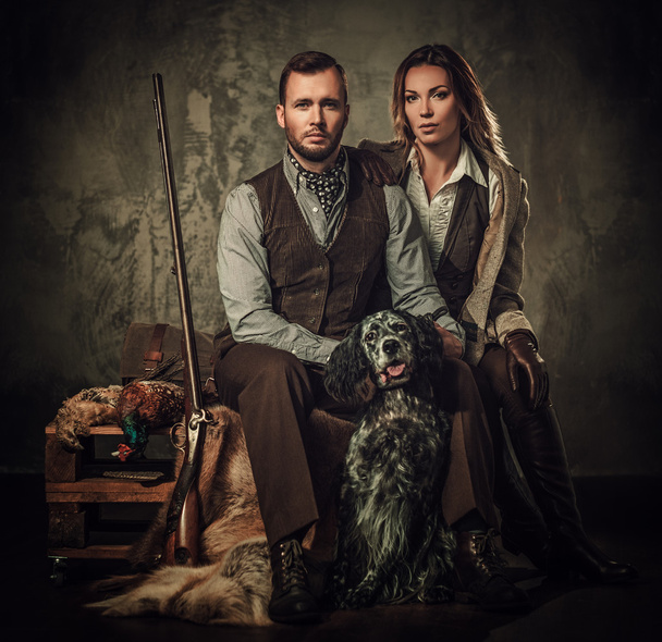 Couple of hunter with a english setter and shotgun - Photo, Image