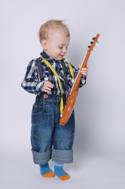 little funny boy with guitar - 写真・画像