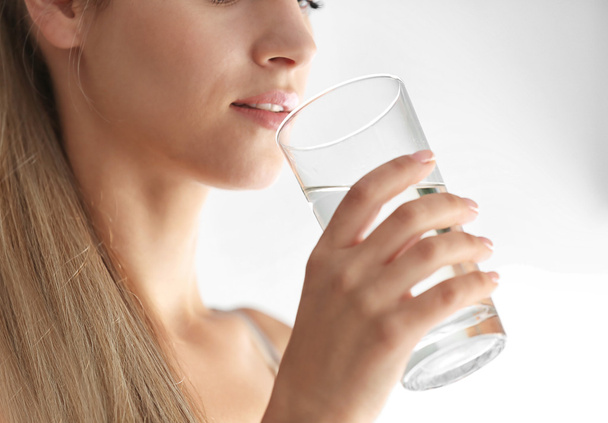 Girl drinking water  - Фото, зображення