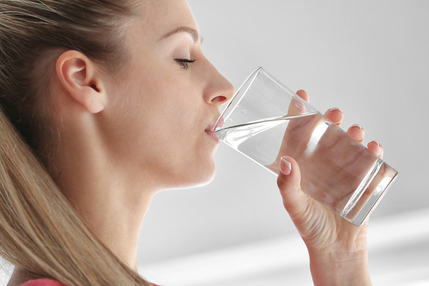 Beautiful girl drinking water  - Foto, imagen