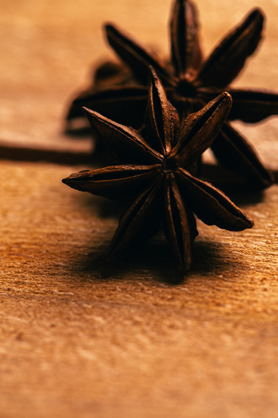 star anise spice whole on a wooden background - Фото, зображення