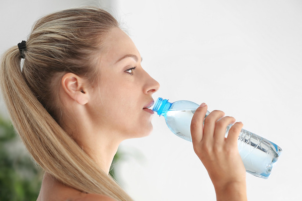 Beautiful girl drinking water  - Photo, Image