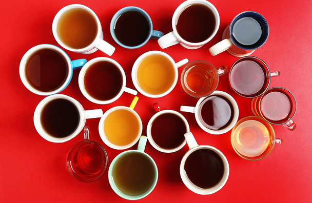 Cups of tea on red  - Фото, зображення