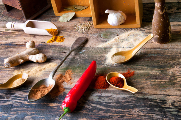 Colorful aromatic spices in old rustic kitchen - Photo, Image