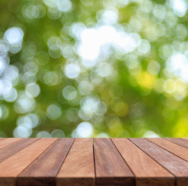 Empty top wooden table and sunny abstract blurred bokeh backgrou - Foto, imagen