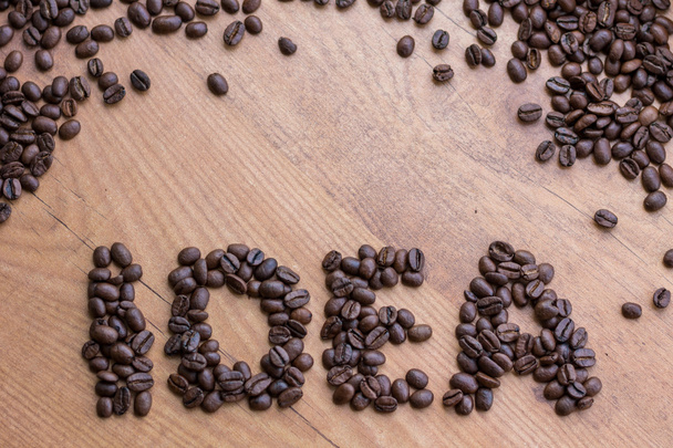 Concepto de Canto de Idea dibujado por granos de café tostados marrón
  - Foto, imagen