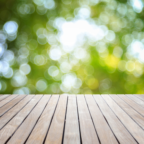 Empty top wooden table and sunny abstract blurred bokeh - Fotoğraf, Görsel
