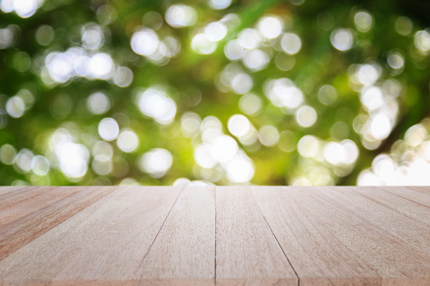 Empty top wooden table and sunny abstract blurred bokeh - Фото, зображення