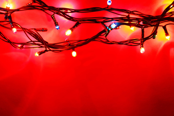 Christmas lights on red - Fotoğraf, Görsel