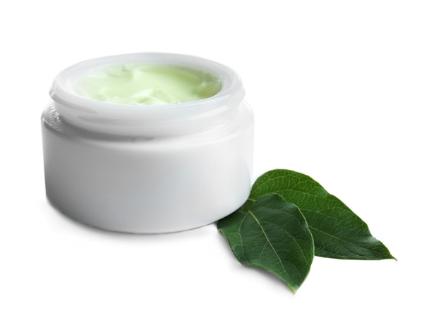 Facial cream and green leaves  - Foto, Imagen