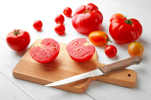 tomatoes on cutting board  - Фото, изображение