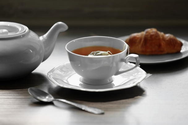 Cup of tea with croissant  - Fotoğraf, Görsel