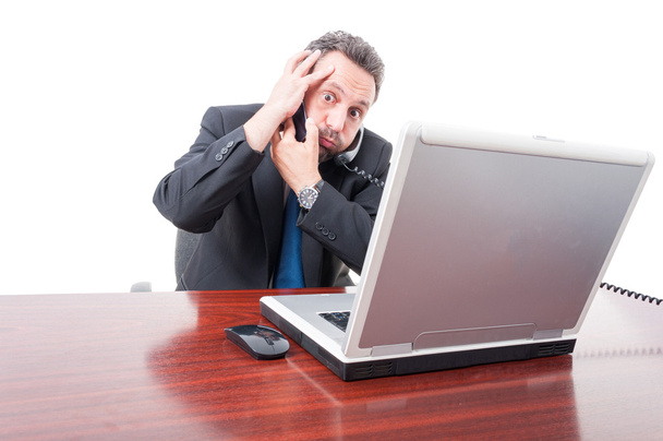 Scared businessman having trouble at work - Foto, Imagen