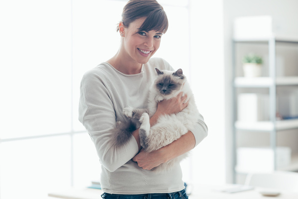 Happy woman with her pet - Фото, изображение