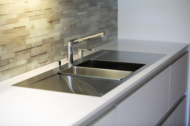 close up of stainless steel kitchen sink - Fotó, kép