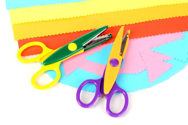 Colorful zigzag scissors with color paper isolated on white - Foto, imagen