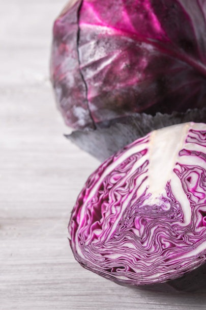 Red cabbage on the white wooden table vertical - Foto, Imagen