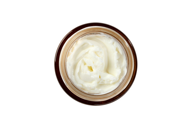  Gezichtscrème met een bruin cover op witte achtergrond - Foto, afbeelding
