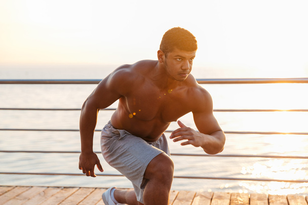 Muscular african young man athlete training outdoors - Valokuva, kuva