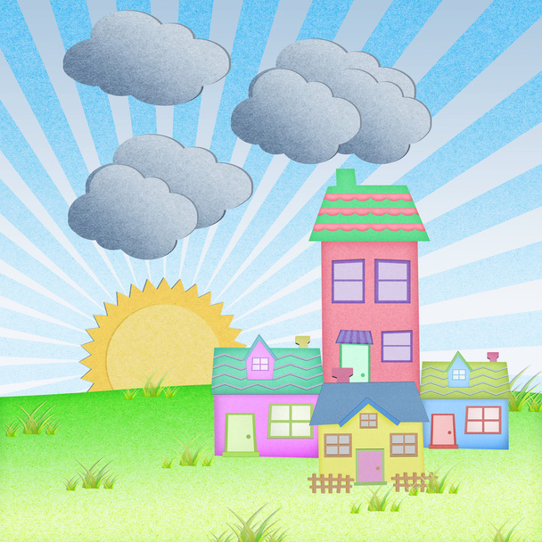 House from recycle paper with grass field and sun set background - Foto, Imagen